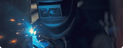 A welder at work, sparks flying