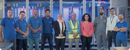 The PESCO team standing together at the factory
